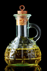 olive oil in jar on black background