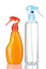 transparent and orange detergent bottles isolated on white