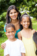 happy indian mother and children outdoors