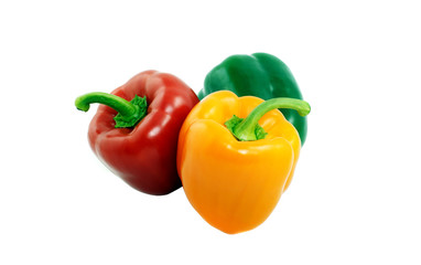 Fresh green, red and yellow paprika isolated on white