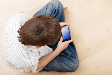 Child with smart phone
