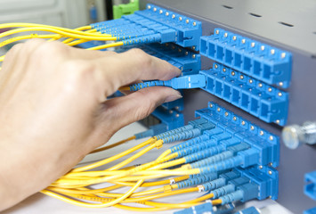 optic fiber cables connected to an optic switch .