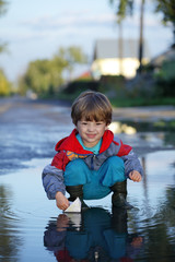 paper ship in children hand
