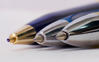 Three ball point pens heads