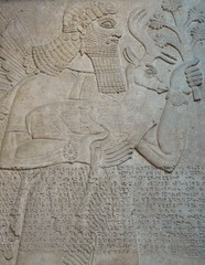 Ancient Assyrian wall carvings of a man
