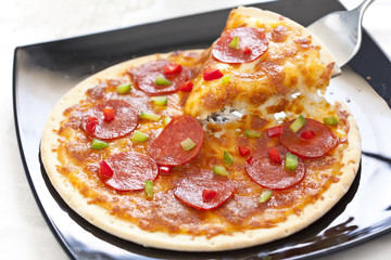 Slice of pepperoni pizza