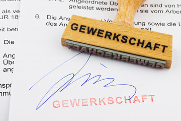 Holzstempel auf Dokument: Gewerkschaft