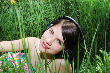 girl listening music in nature
