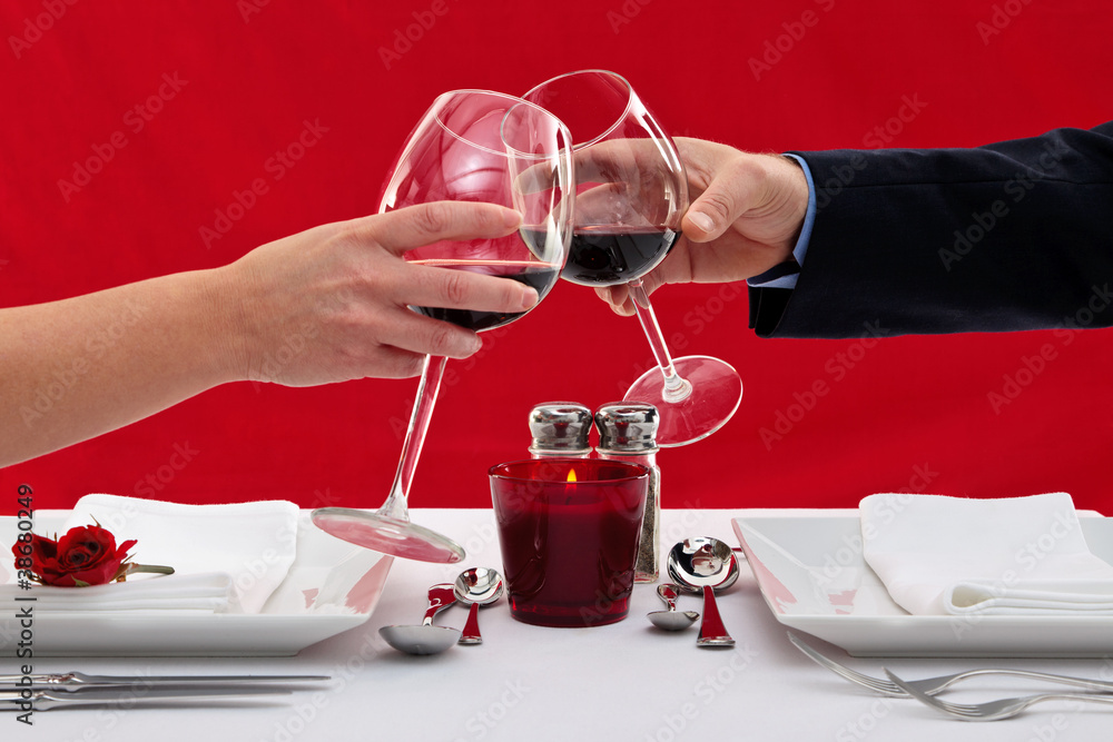 Wall mural couple toasting their glasses