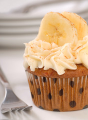 Delicious carrot cake cupcake with cream cheese frosting, sliced