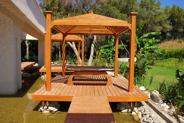 wood pavilion in tropical garden on summer resort