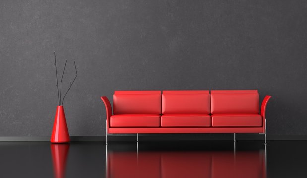 Wohndesign - rotes Sofa vor grauer Wand