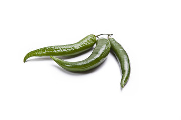 Spicy green peppers isolated on white background