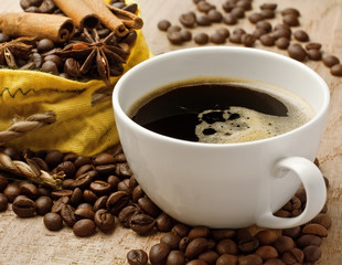 Coffee on beans with cinnamon bark and anise