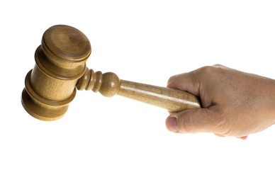 Hand gripping a wooden gavel