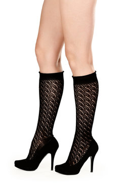 female legs in fishnet socks and shoes