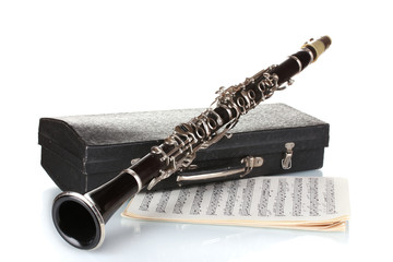 Antique clarinet, case and notebook with notes isolated on white - obrazy, fototapety, plakaty