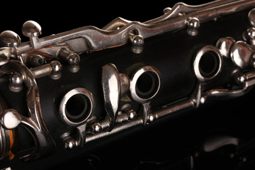 Fototapeta premium close up detail of clarinet on black background