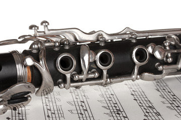 Obraz premium close up detail of clarinet and notebook with notes