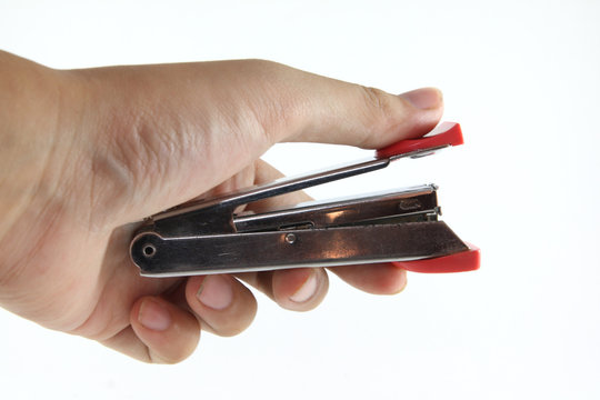 Hand holding stapler