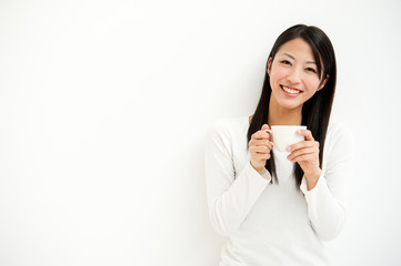 attractive asian woman relaxing in the white room