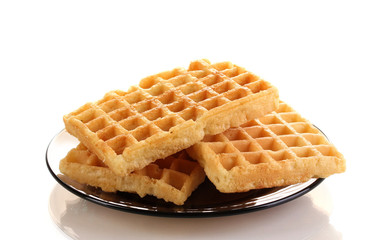 Sweet waffles on plate isolated on white