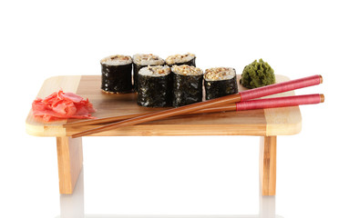 Tasty rolls served on wooden plate isolated on white