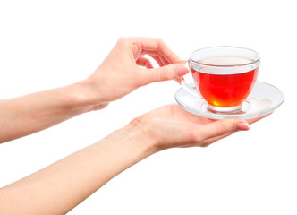 holding a cup of warm tea in hands