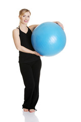 Young girl with fit ball