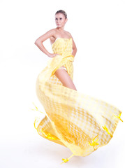 Beautiful dancer wearing yellow dress isolated on white - obrazy, fototapety, plakaty