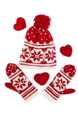 winter cap and mittens with knitted motifs. on white
