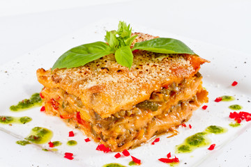 Closeup of lasagna and basil fork