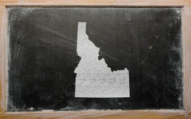 outline map of us state of idaho on blackboard