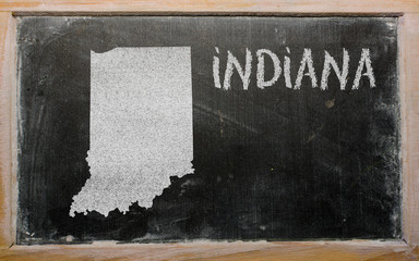 outline map of us state of indiana on blackboard