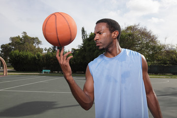 Fototapeta premium Basketball player spinning the ball