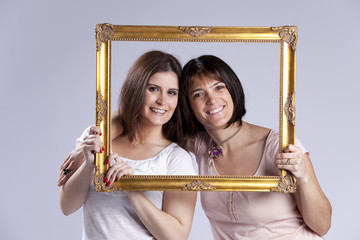 two woman inside a picture frame