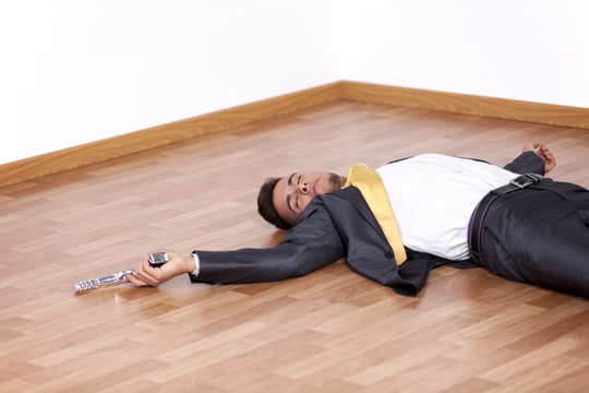 Dead businessman in the floor