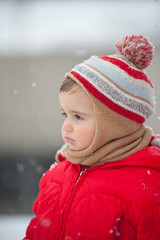 Portrait of baby boy in the snow.