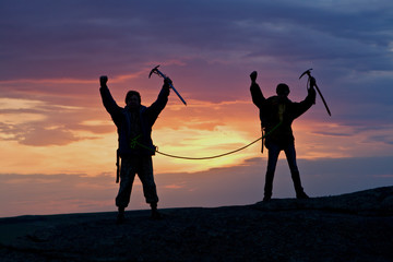 Two climbers connected by rope