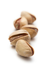 Pile of pistachios on white