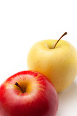 Red and yellow apples on white