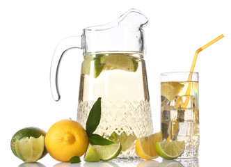 pitcher and glass of lemonade and lemon isolated on white