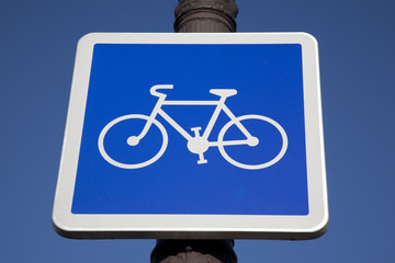 Blue Bike Sign on Sky Background
