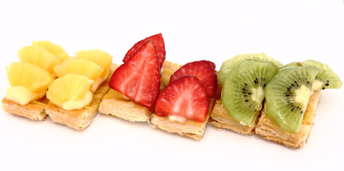 Fruit dessert of kiwi, strawberries and pineapple