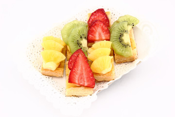 Fruit dessert of kiwi, pineapple and strawberries