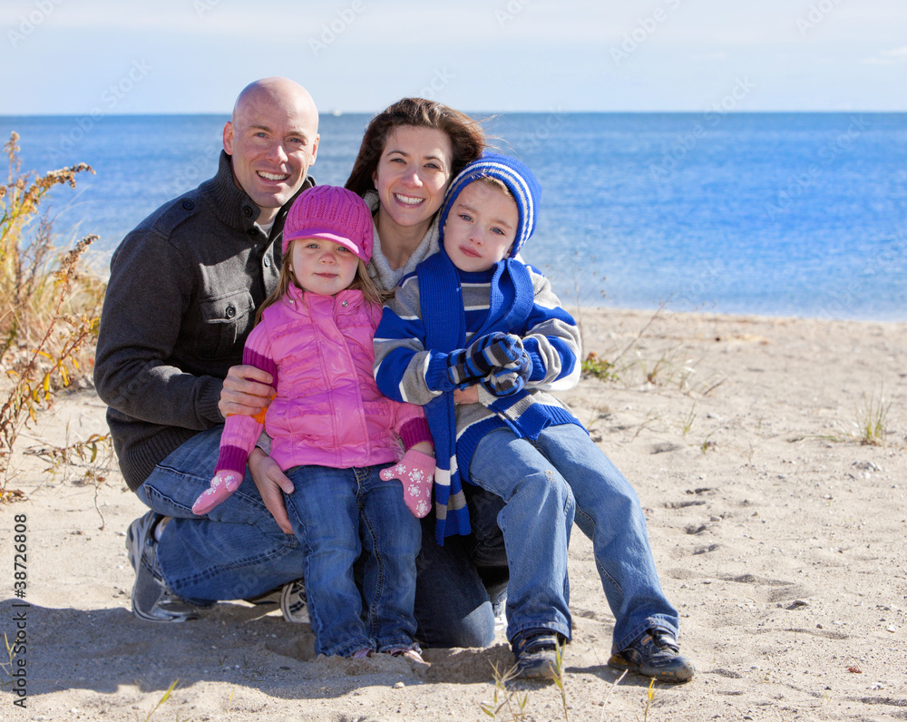 Wall mural family of four at the beach