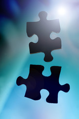 Zwei Puzzleteile als Sinnbild f&uuml;r Zusammenarbeit