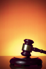 judge gavel on orange background