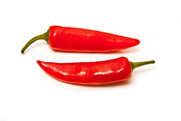 Red chilli peppers isolated on a white studio background.