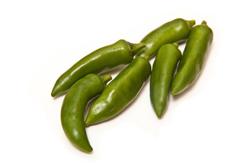 Green chilli peppers isolated on a white studio background.